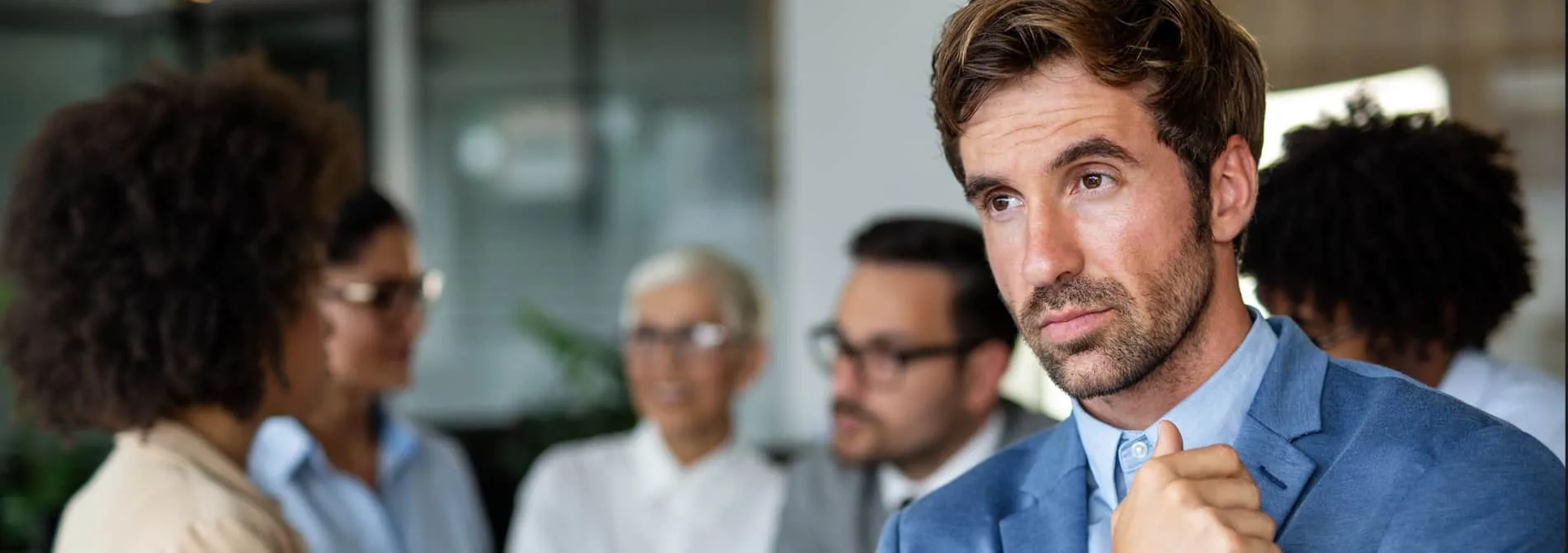 Portrait of stressed business man working in corporate office