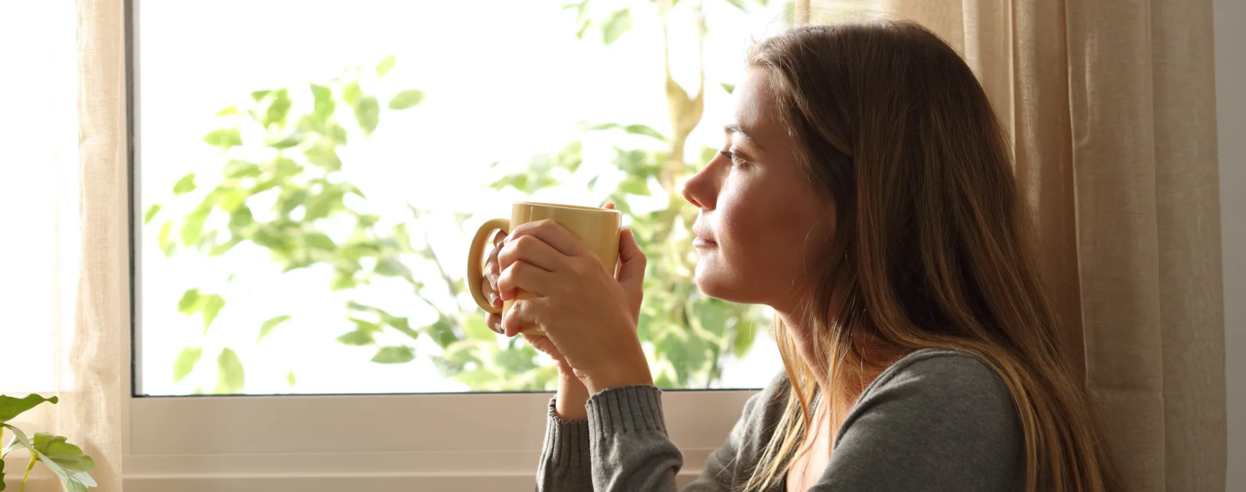 woman looking through a window