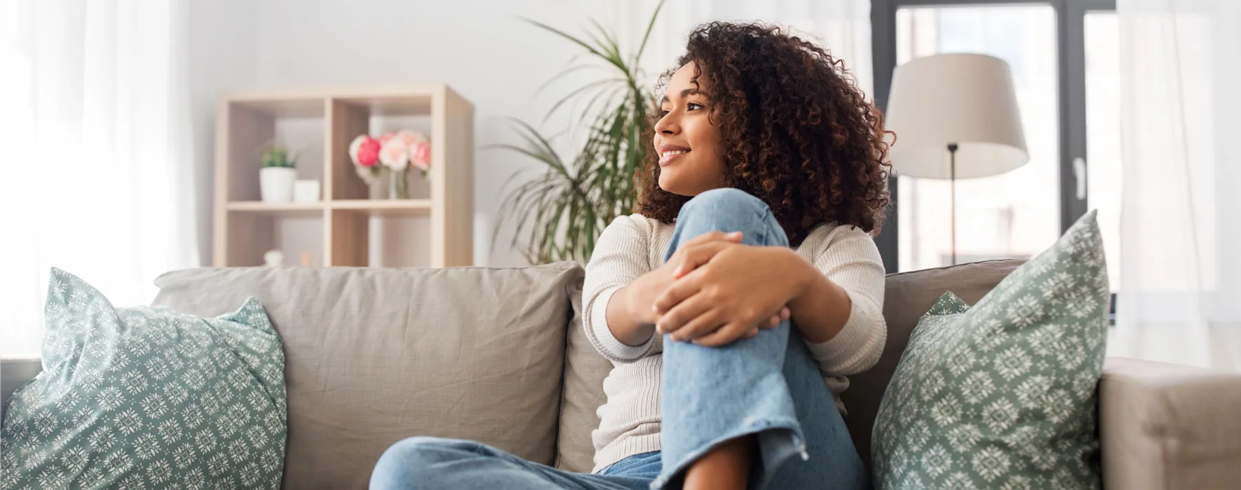 woman smiling on couch